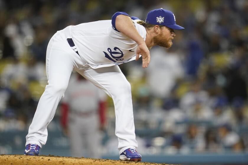 Los Angeles Dodgers relief pitcher Craig Kimbrel stands on the mound during the ninth inning of a baseball game against the Cincinnati Reds in Los Angeles, Friday, April 15, 2022. (AP Photo/Ashley Landis)