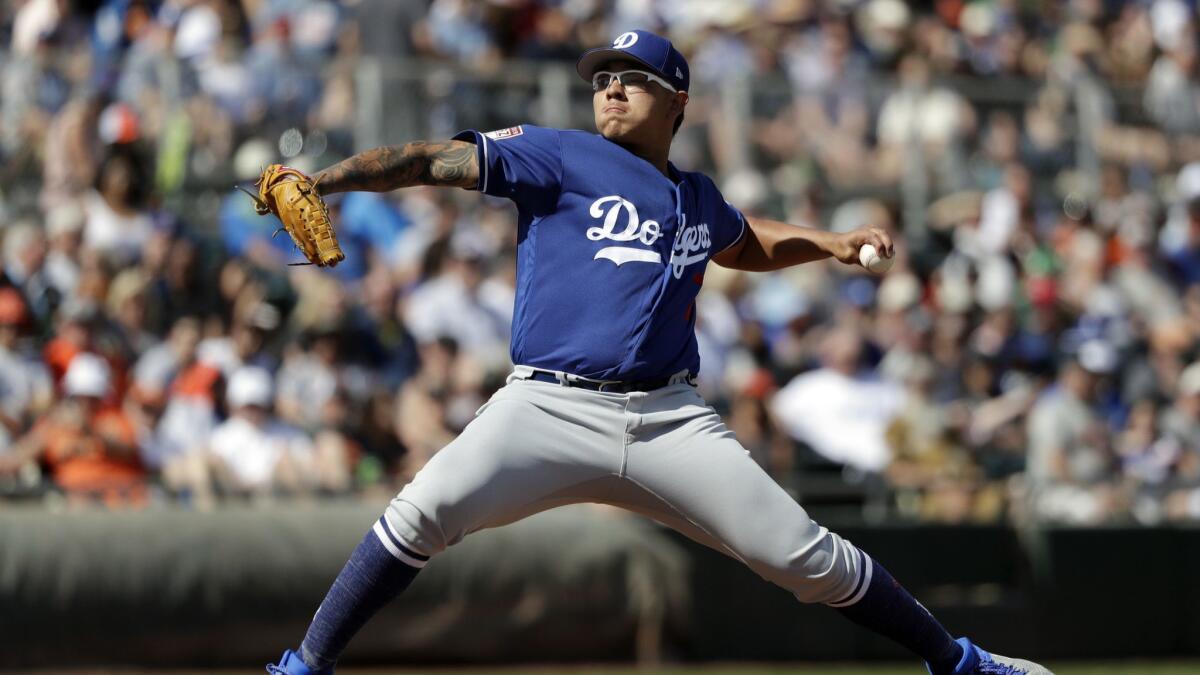 Dodgers starting pitcher Julio Urias throws against the San Francisco Giants in a spring-training game on March 4, 2019.