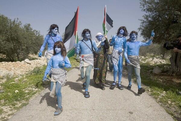 Palestinian, Israeli and international demonstrators, dressed like Na'vi characters from the blockbuster film "Avatar", take part in the weekly protest against Israel's controversial barrier in Bilin, near the West Bank town of Ramallah. Read more