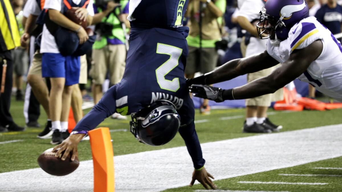 Seahawks quarterback Trevone Boykin flips into the end zone for a two-point conversion against the Vikings during a preseason game.