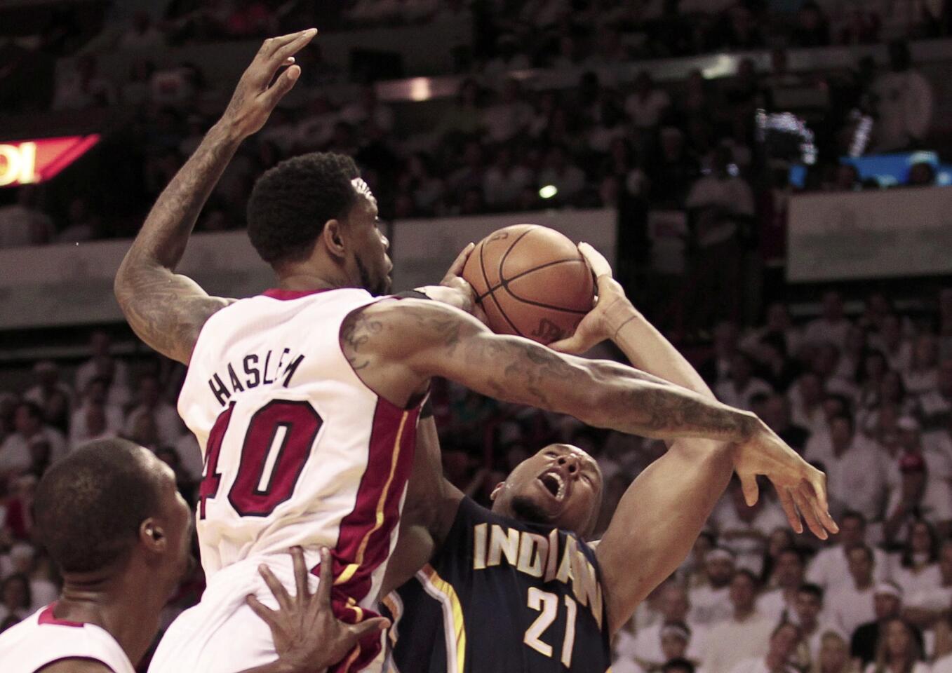 Miami Heat's Haslem fouls Indiana Pacers' West during the first quarter in Game 1 of their NBA Eastern Conference second round basketball playoff series in Miami