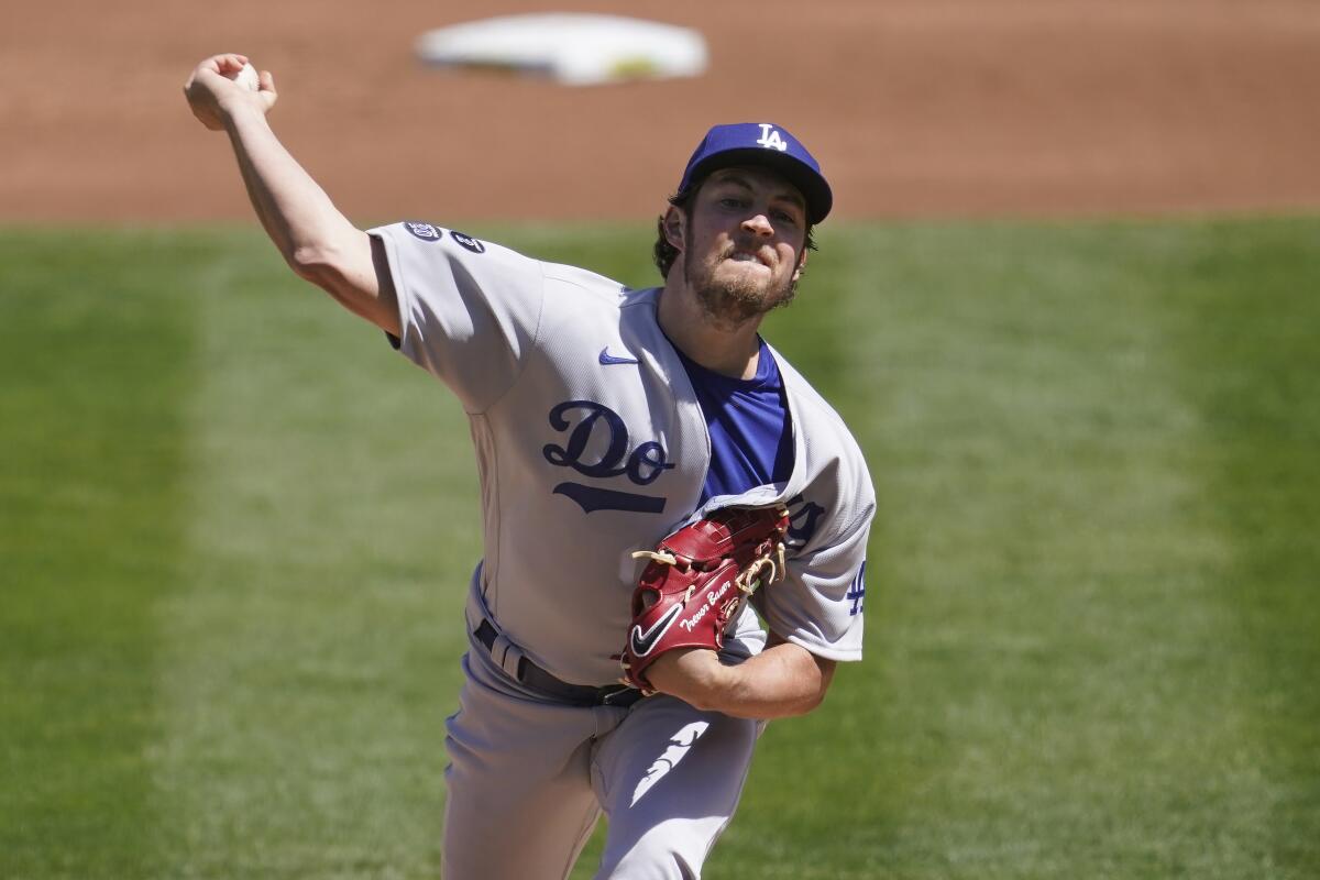 Dodgers pitcher Trevor Bauer throws against the Oakland Athletics.