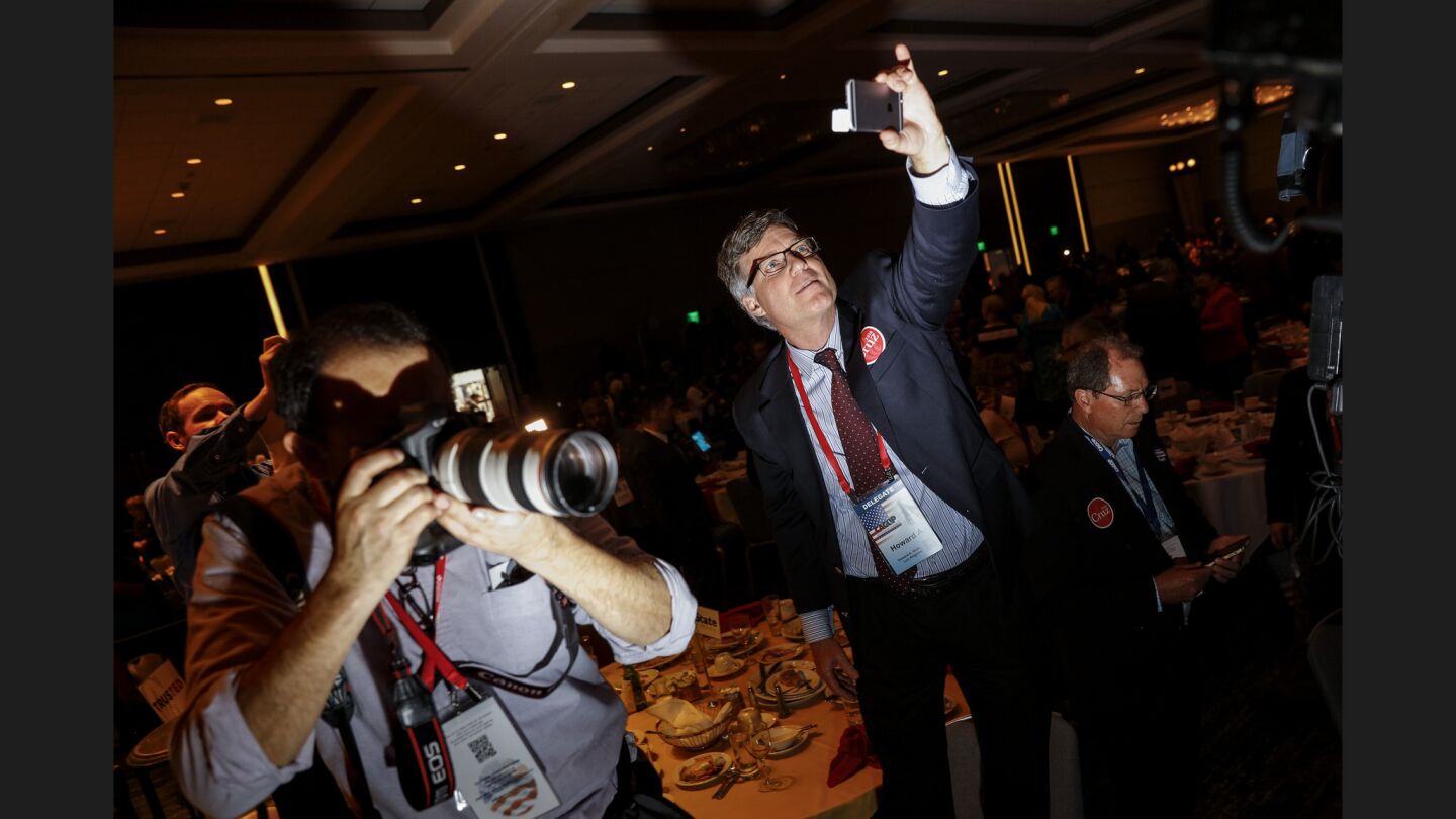 People angle for photos of Republican presidential candidate Ted Cruz after his speech at the California Republican Party convention.