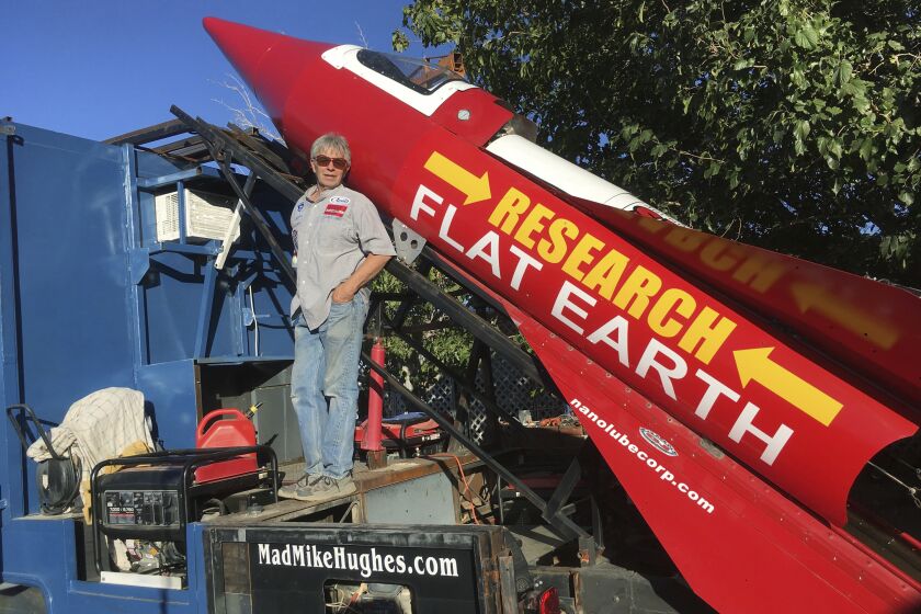 In this Wednesday, Nov. 15, 2017, photograph, daredevil/limousine driver Mad Mike Hughes is shown with with his steam=powered rocket constructed out of salvage parts on a five-acre property that he leases in Apple Valley, Cal. Hughes plans to launch his homemade contraption on Saturday near the ghost town of Amboy, Cal., at a speed of roughly 500 miles-per-hour. (Waldo Stakes/HO courtesy of Mad Mike Hughes via AP)