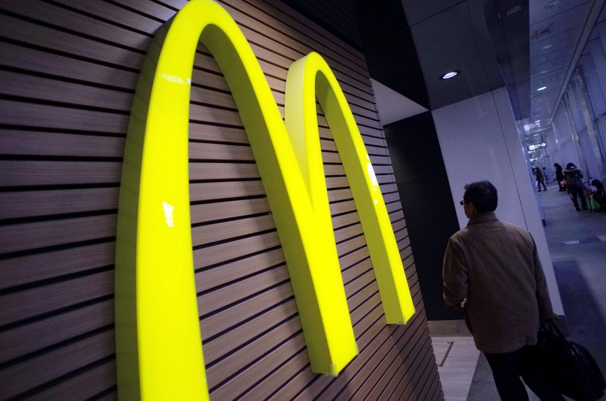 McDonald's Corp. Chief Executive Steve Easterbrook said Monday the company would change its organizational structure and re-franchise more restaurants as part of a turnaround plan to boost profits and win back customers.
