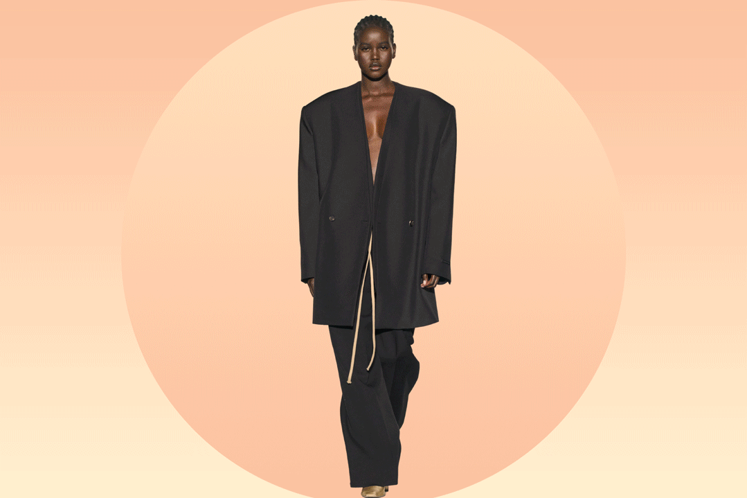 A warm peach gradient background with runway models from the Fear of God FW23 show alternating in the center
