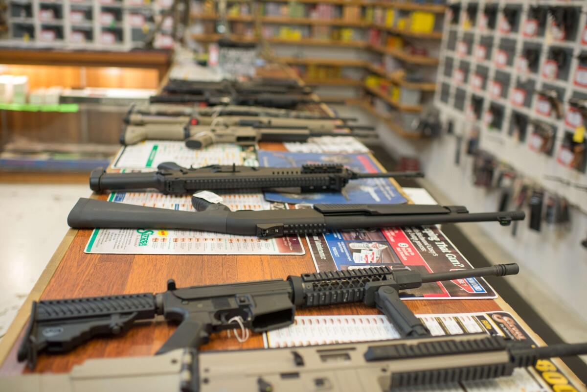 Guns are on display at Roseburg Gun Shop in Roseburg, Ore., on Oct. 2.