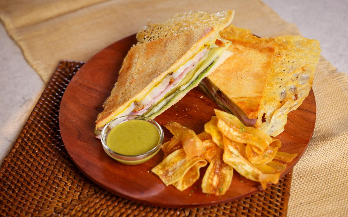 Cubanos with dipping sauce and fried burro bananas.