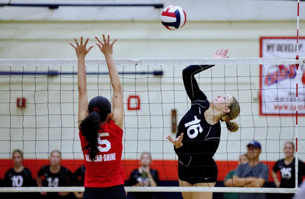 Tournament MVP London Halvorsen spikes the ball during a match against Taft.