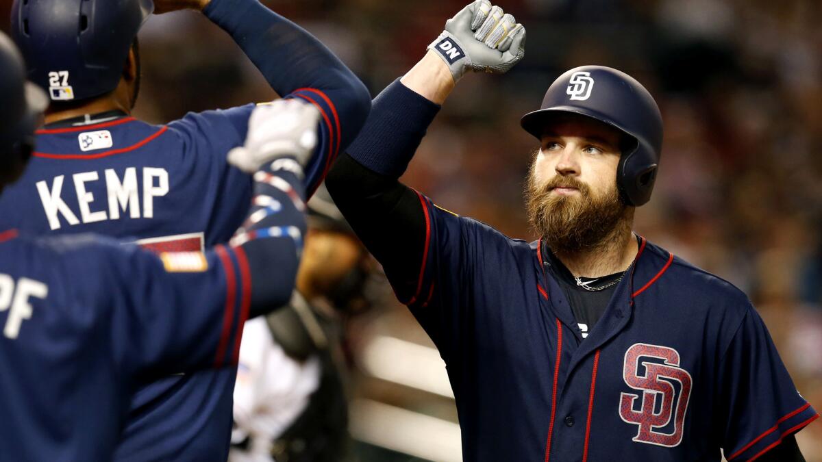 Padres catcher Derek Norris celebrates with teammates after hitting a home run during a game against the Diamondbacks last season.