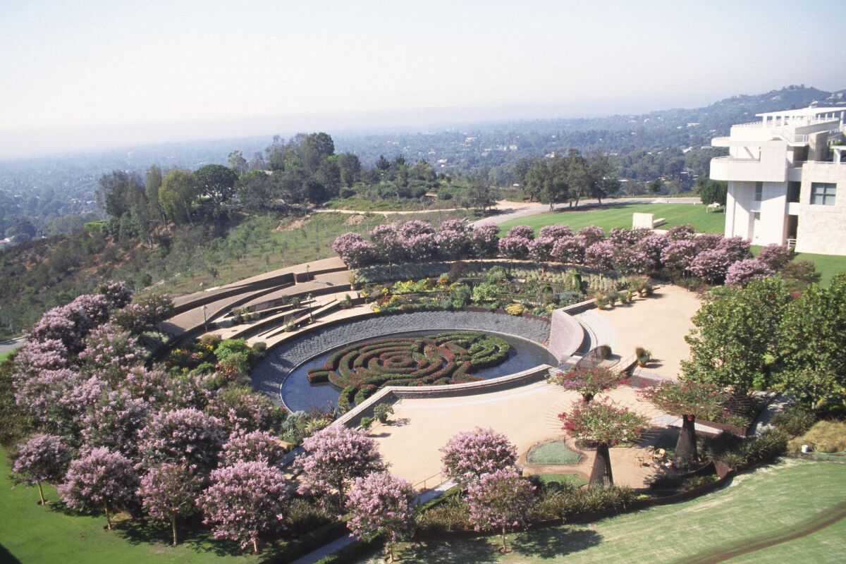 A large circular garden with an azalea maze in the middle is seen from above.
