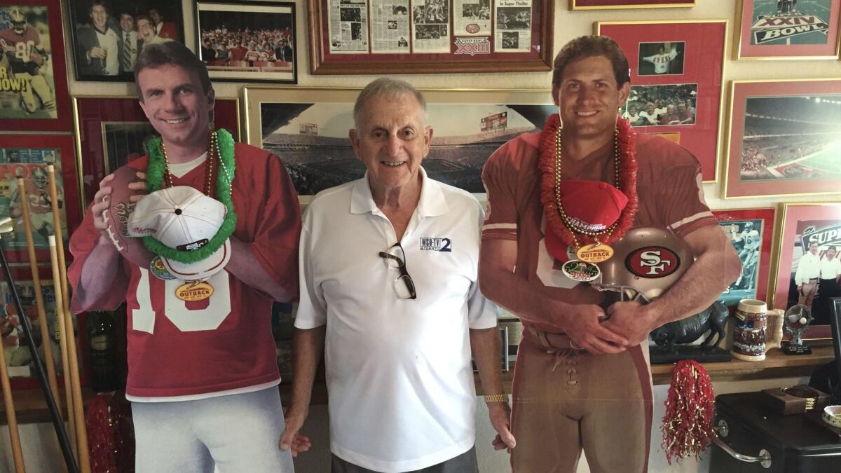 John McVay, Sean McVay's grandfather and the former 49ers exec who built Super Bowl teams with Bill Walsh, lives outside Sacramento. Here, he poses with cutouts of former 49ers quarterbacks Joe Montana and Steve Young.