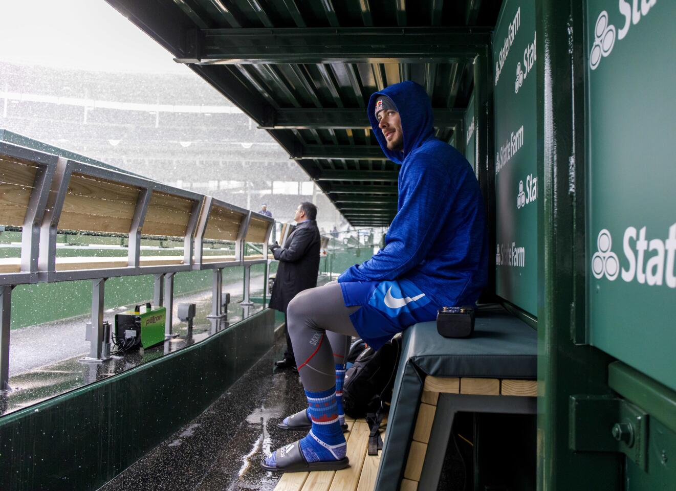 Kris Bryant checks out the new dugout and the snow on Monday, April 9, 2018 on opening day at Wrigley Field. The game was postponed.