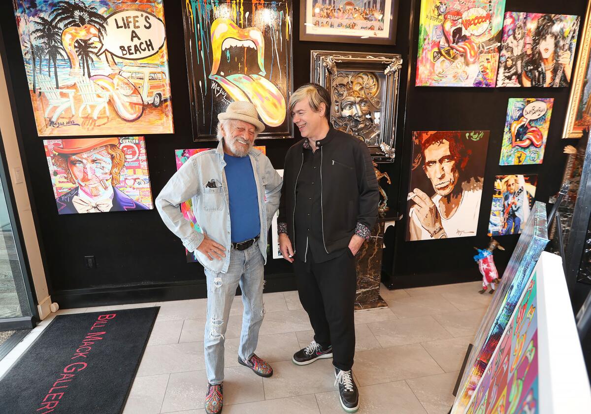 Artist Ruby Mazur and art consultant David Michael Vaughn, from left, in the Bill Mack Gallery in Laguna Beach.