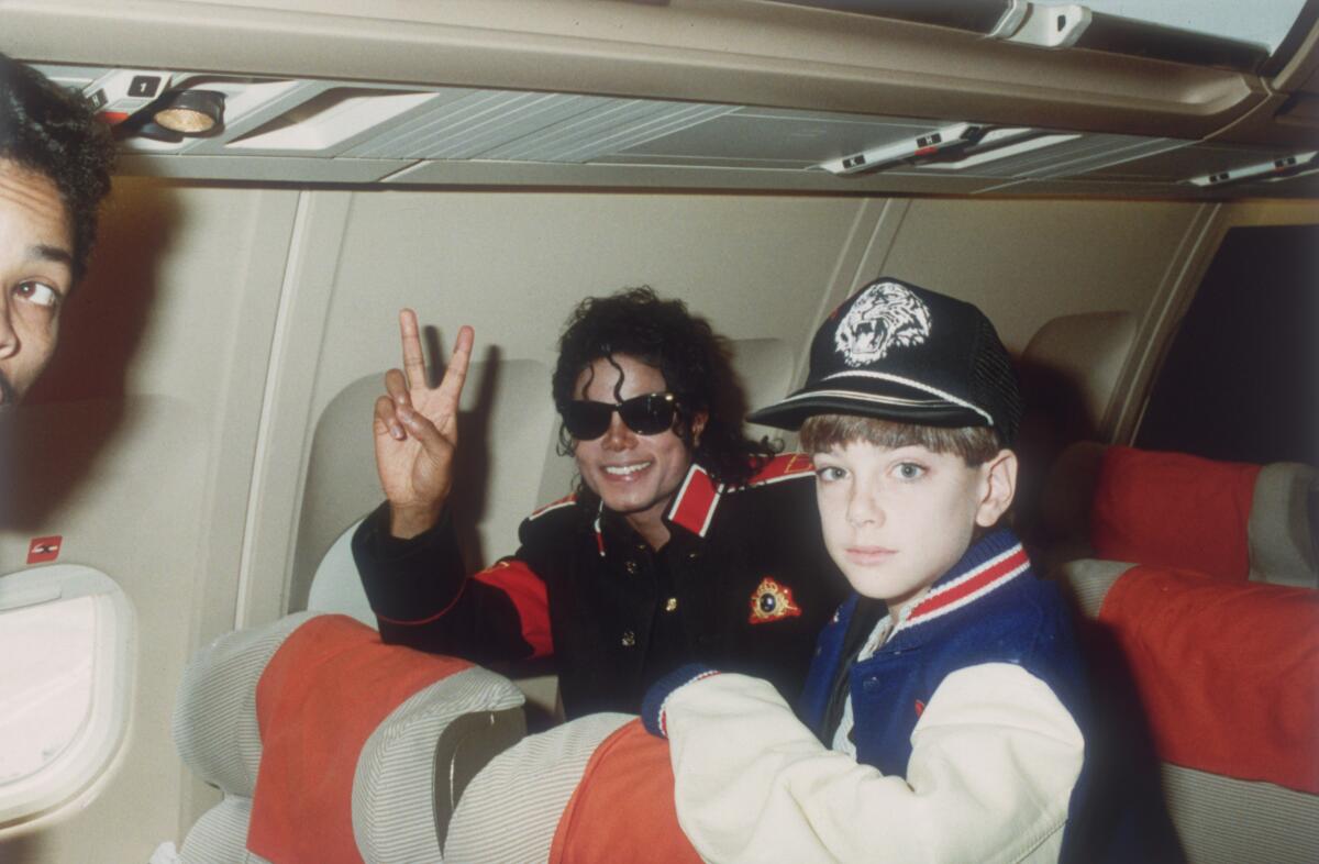 Michael Jackson with 10-year-old Jimmy Safechuck on the pop star's tour plane on July 11, 1988.