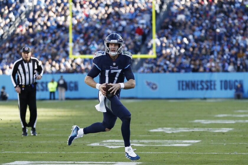 Tennessee Titans quarterback Ryan Tannehill (17) heads to the end zone for a touchdown against the Jacksonville Jaguars during the second half of an NFL football game, Sunday, Dec. 12, 2021, in Nashville, Tenn. (AP Photo/Wade Payne)
