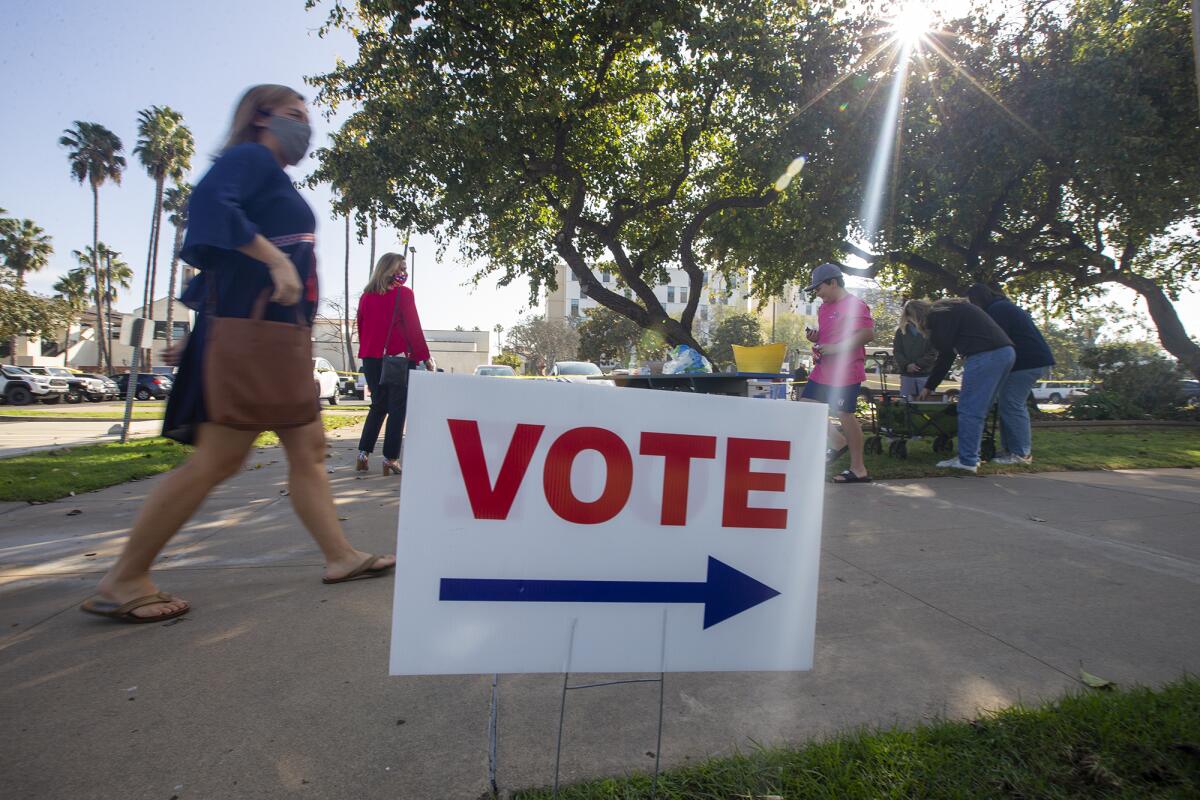 Voters make their way to the Costa Mesa City Hall voting center to cast their votes in the November 2020 election.
