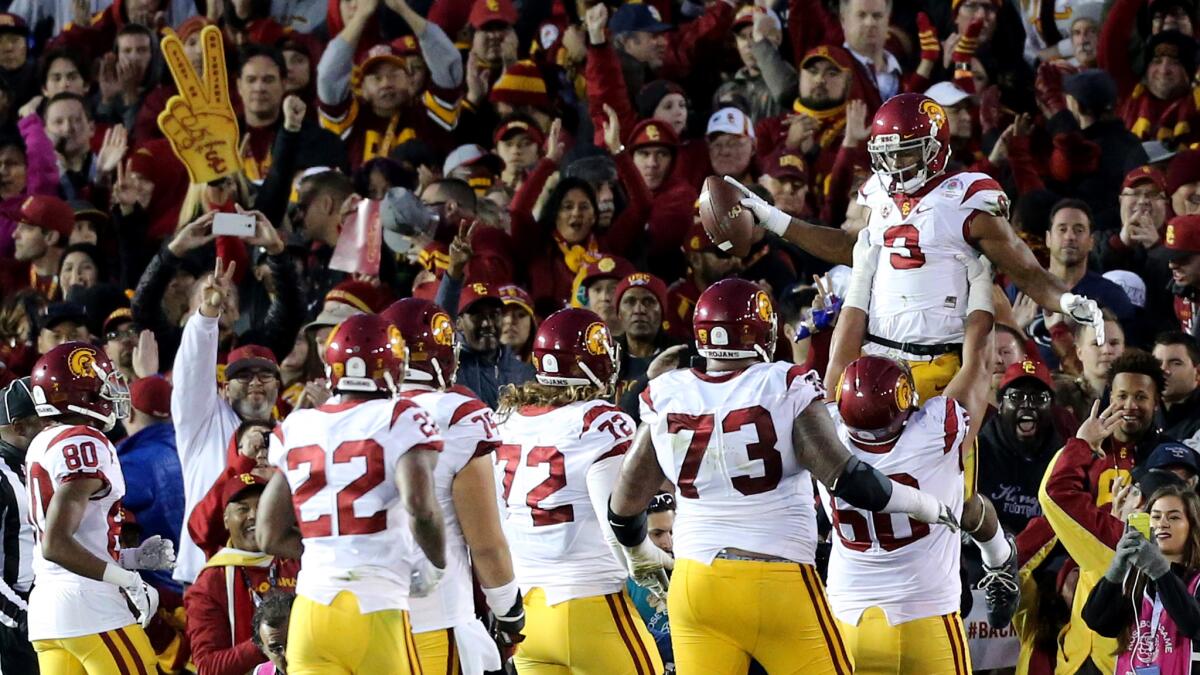 USC wide receiver Juju Smith-Schuster celebrates with teammates after making a touchdown catch against Penn State in the third quarter.
