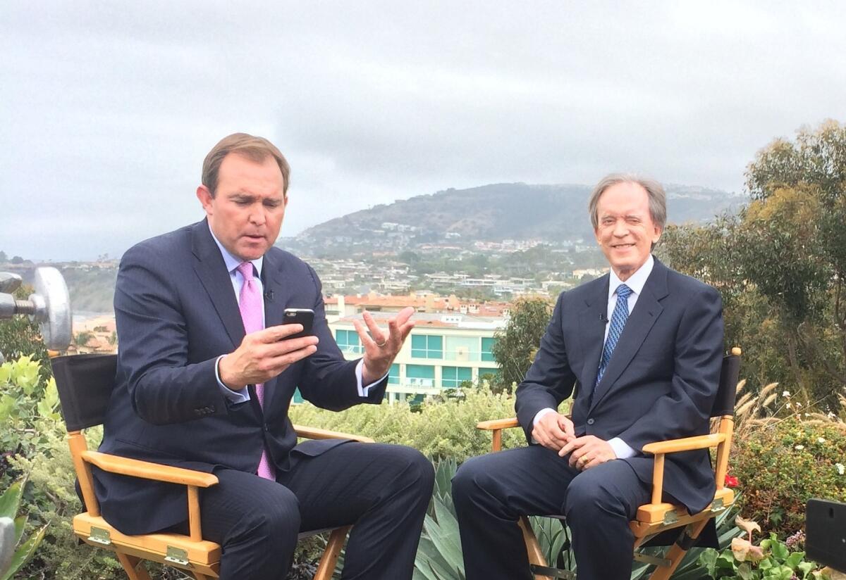 Bond investor Bill Gross, right, with CNBC's Brian Sullivan in Dana Point. Sullivan moderated an investment outlook session for clients of Janus Capital Group, where Gross runs a bond fund.
