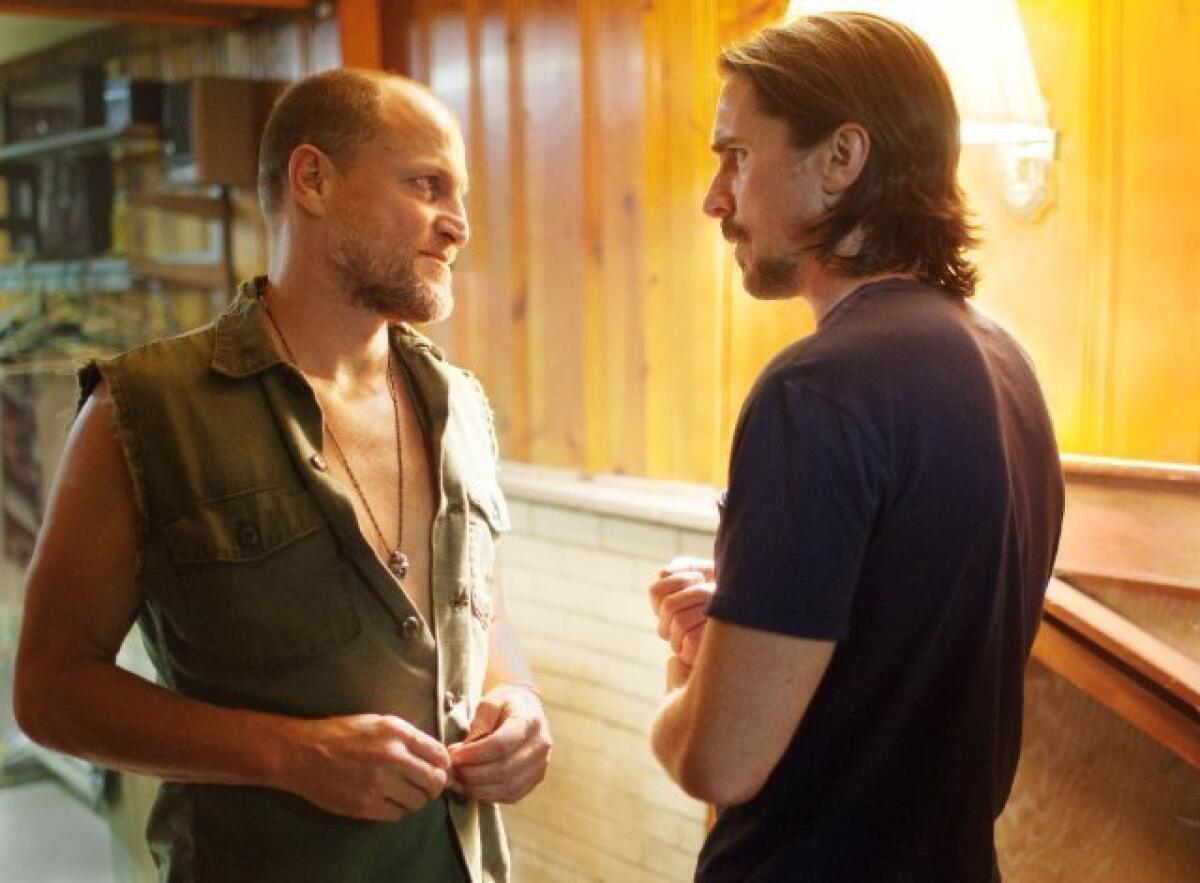 Woody Harrelson, left, and Christian Bale in "Out of the Furnace."