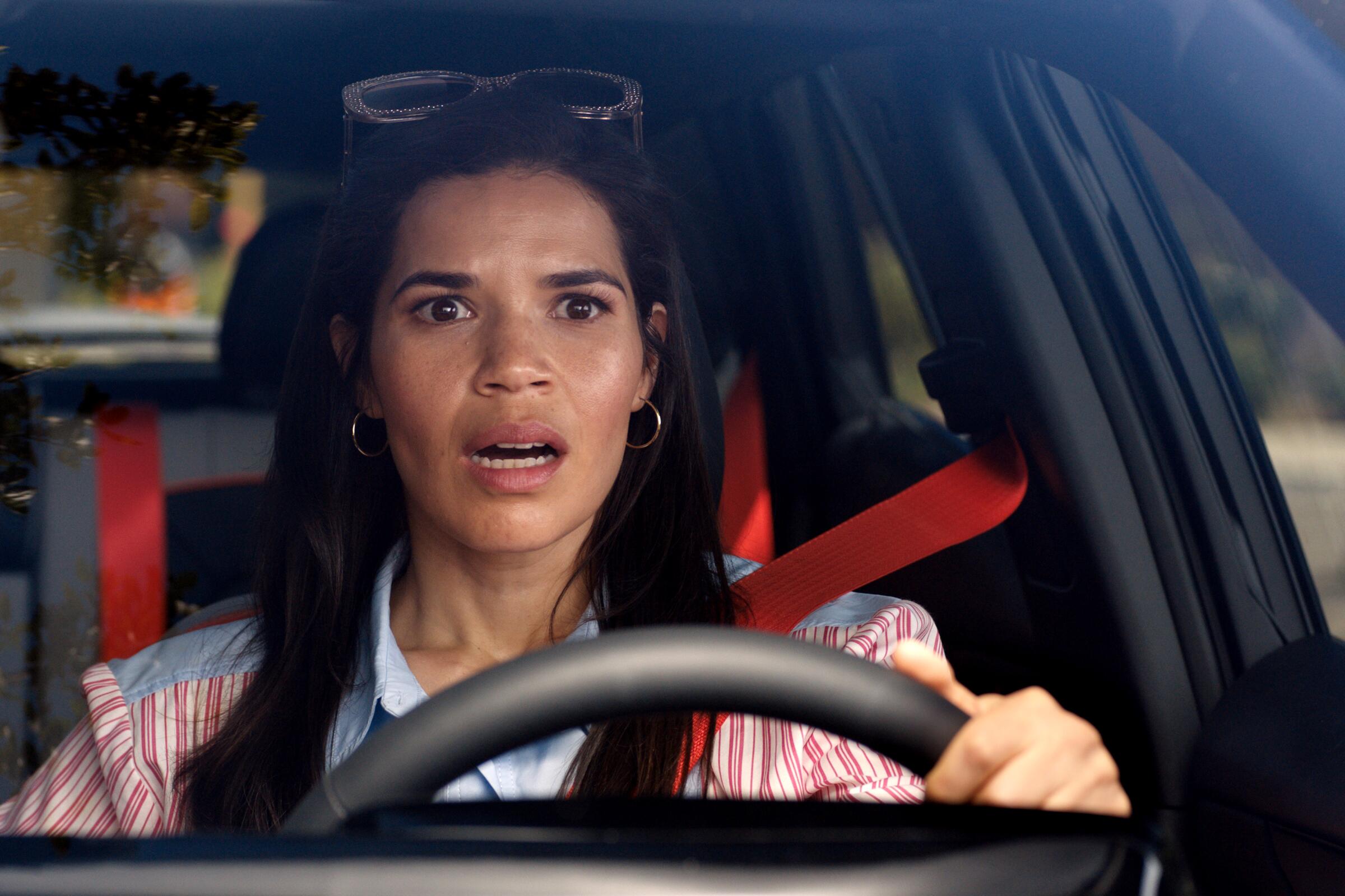 America Ferrera looks stressed as she drives a car in "Barbie."