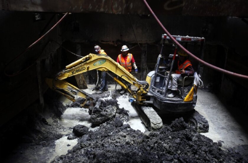 Construction crews continue to dig an exploratory shaft 70-feet deep in preparation for the future Purple Line.