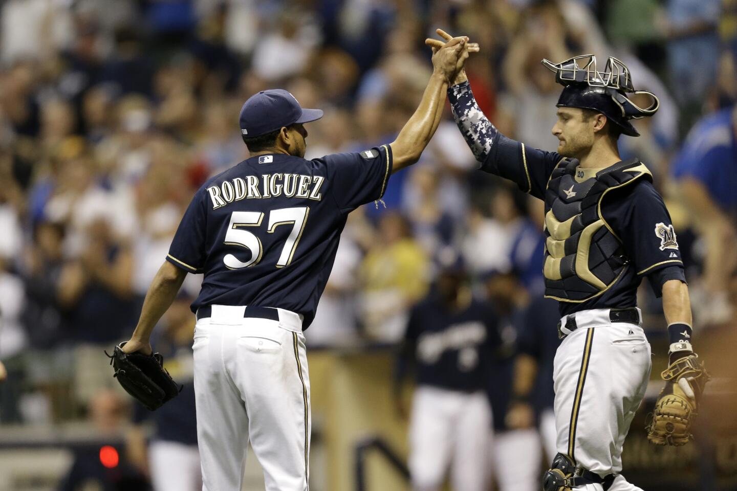 Francisco Rodriguez celebrates with Jonathan Lucroy after the 2-1 win over the Chicago Cubs.