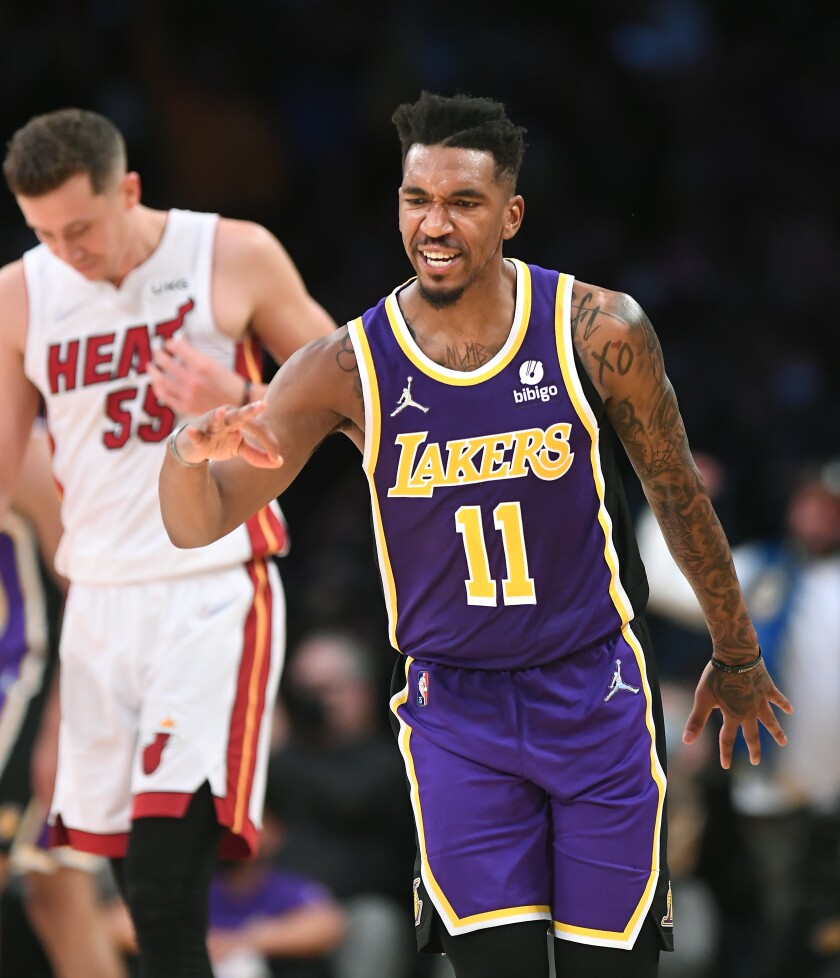 Lakers guard Malik Monk celebrates after making a three-pointer against the Heat.