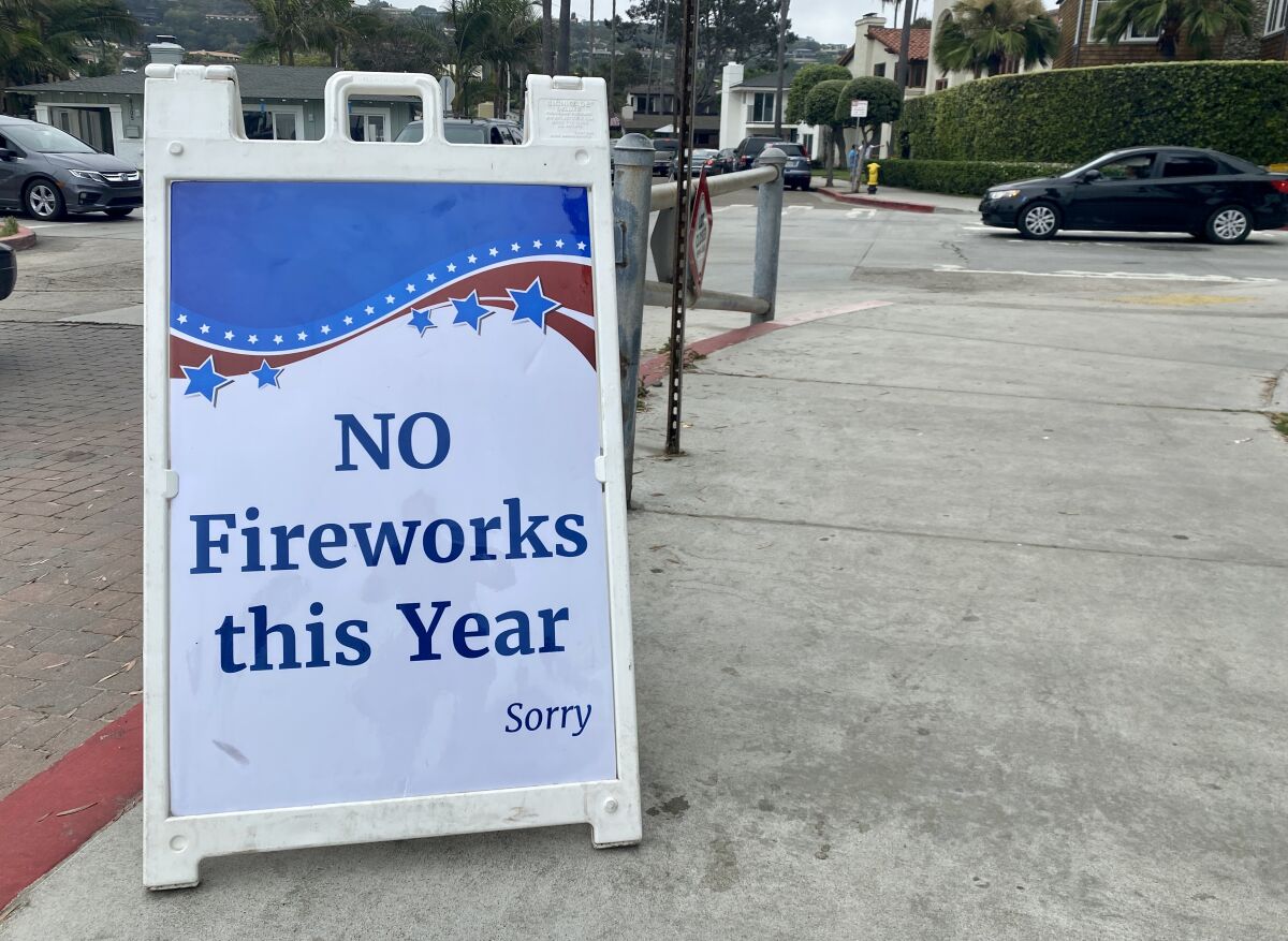 A sign at Kellogg Park in La Jolla Shores on July 3 confirms the La Jolla fireworks show will not go on.