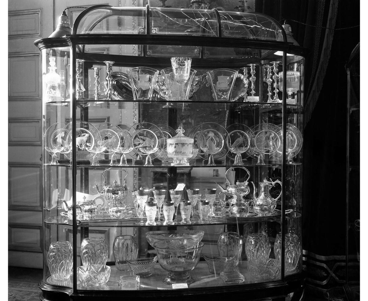 Nov. 17, 1947: Some of the royal wedding gifts are displayed at St James's Palace, London, when they were on view to the public. In the center of the middle shelf is the vase of engraved Steuben glass given to the couple by U.S. President Harry S. Truman.