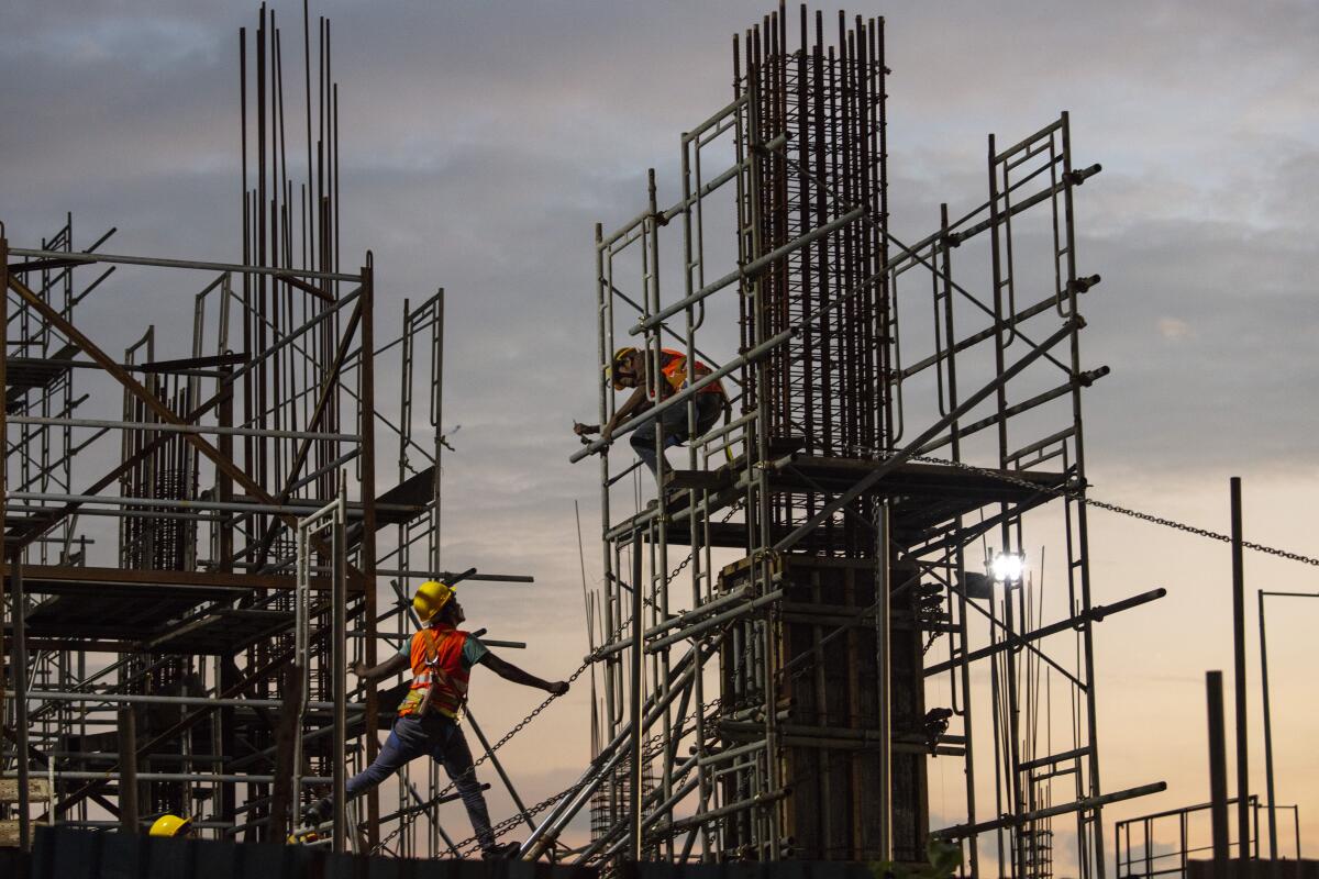 Chinese construction workers at a building site at Port City Colombo, a Chinese-backed development in the Sri Lankan capital, in 2018.