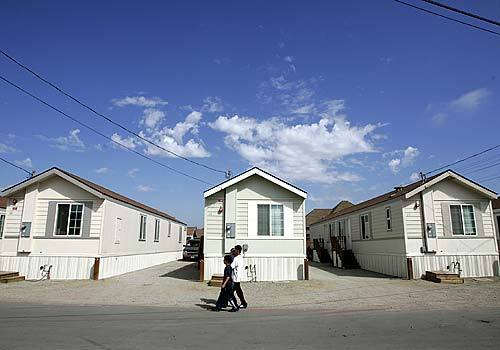 New mobile homes stand where a dilapidated farm labor complex once was in Pajaro, Calif. Sabino Lopez, a former farmworker who worked with Eliseo Medina, is deputy director of the Salinas-based Center for Community Advocacy, the nonprofit firm behind the project.