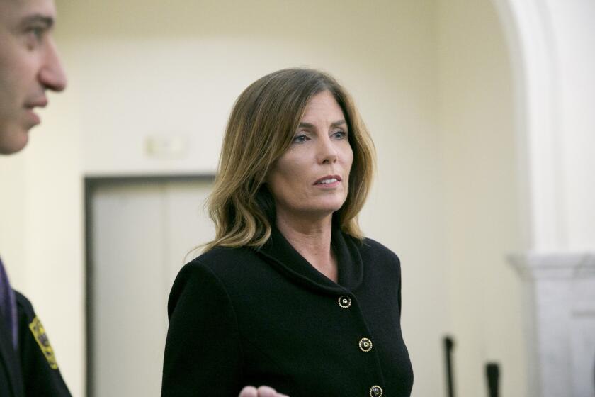 Pennsylvania Atty. Gen. Kathleen Kane leaves the courtroom after closing arguments in her perjury and obstruction trial at the Montgomery County Courthouse on Aug. 15 in Norristown, Pa.