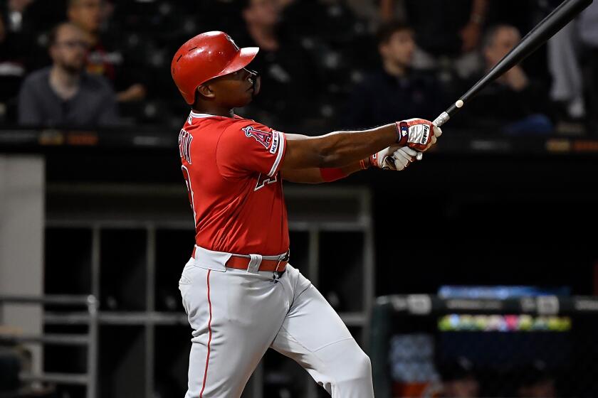 Angels' Justin Upton hits a home run in the ninth inning against the Chicago White Sox on Sept. 6.