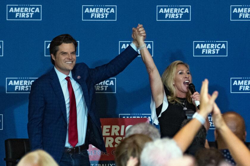 DALTON, GA - MAY 27: U.S. Reps. Marjorie Taylor Greene (R-GA) and Matt Gaetz (R-FL) speak at an America First Rally on May 27, 2021 in Dalton, Georgia. The two Republicans, among the most outspoken supporters of former President Donald Trump, are co-hosting a cross-country series of rallies. (Photo by Megan Varner/Getty Images)