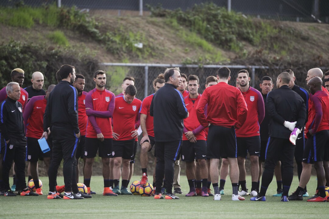 Coach Bruce Arena, center, talks to the U.S. men's national soccer team in 2017