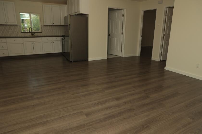 Los Angeles, CA - August 06: Inside a home for rent in Glassell Park with gray laminate floors on Tuesday, Aug. 6, 2024 in Los Angeles, CA. (Michael Blackshire / Los Angeles Times)