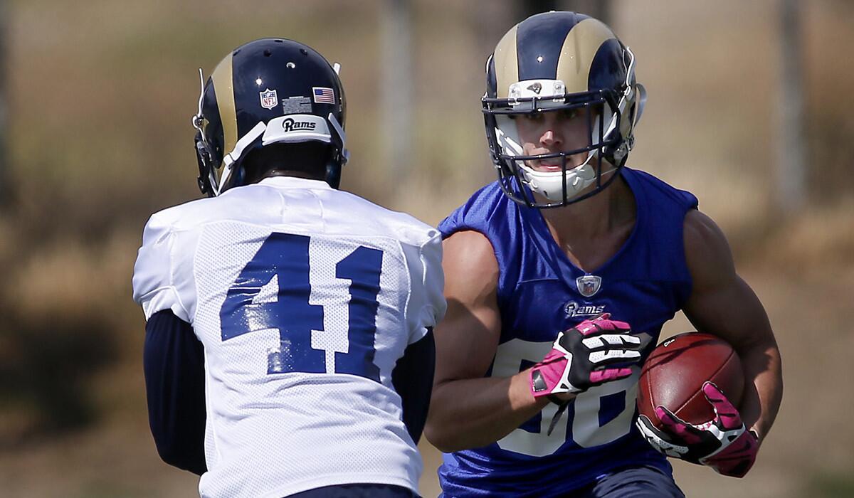 Rams wide reciever Nelson Spruce, right, looks to run past defensive back Winston Rose during the team's rookie mini-camp in Oxnard on May 7.