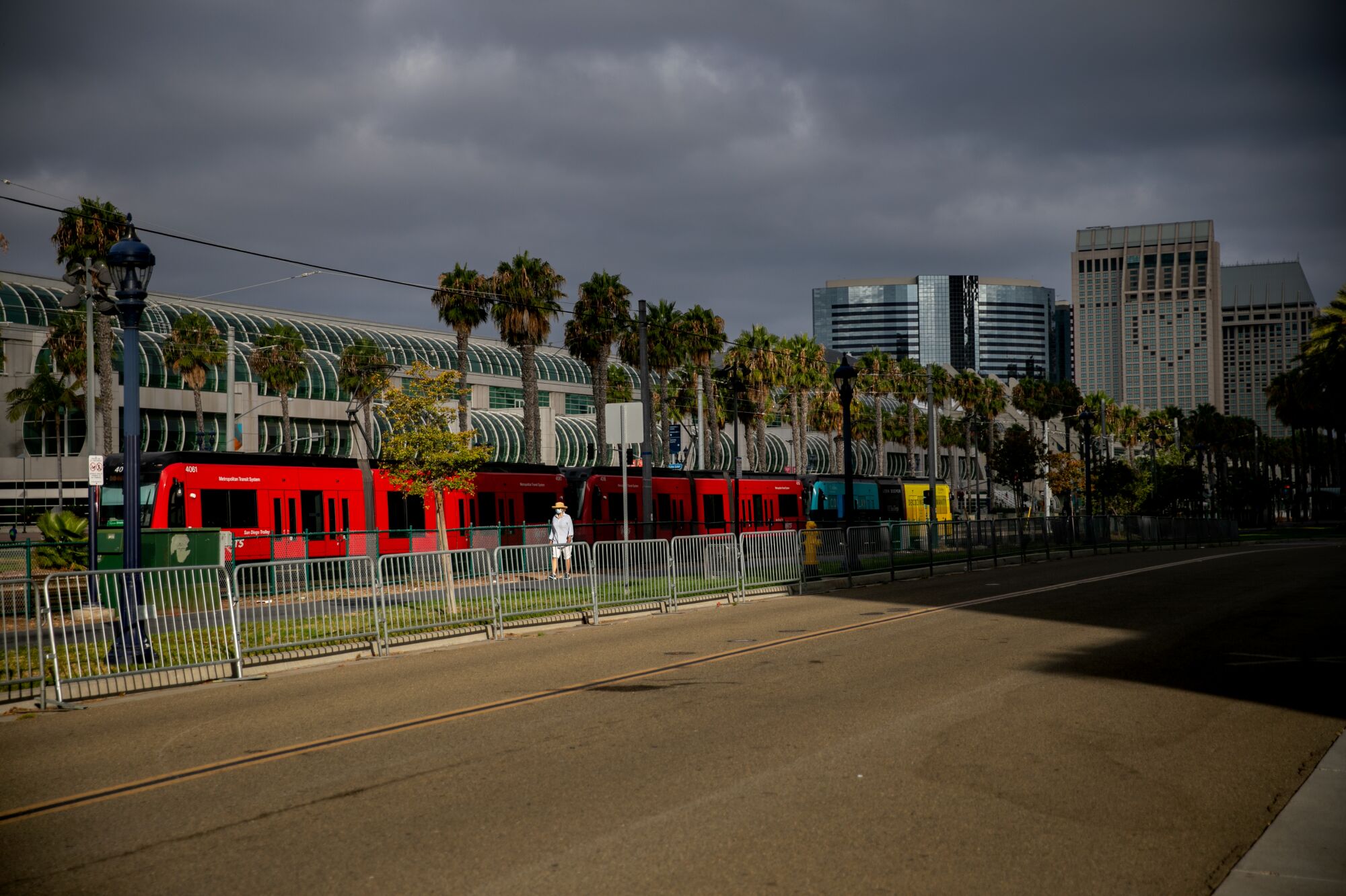 S San Diego Metropolitan Transit System trolley cars pull into the 12th and Imperial station
