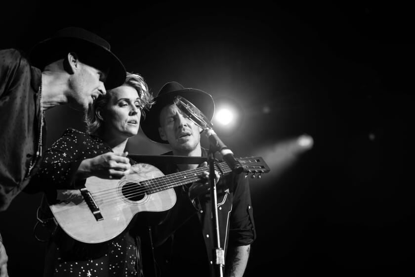 A photograph of Phil Hanseroth, Brandi Carlile, Tim Hanseroth.