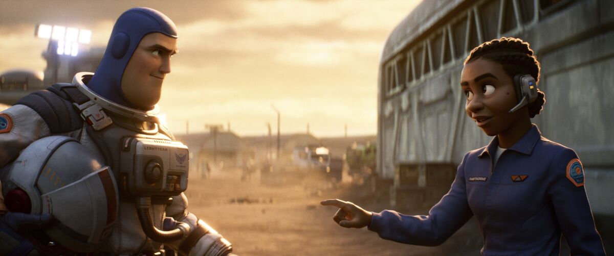 FILE - This image released by Disney/Pixar shows character Buzz Lightyear, voiced by Chris Evans, left, and Alisha Hawthorne, voiced by Uzo Aduba, in a scene from the animated film "Lightyear," releasing June 17. The United Arab Emirates on Monday, June 13, 2022, banned the upcoming Pixar animated feature “Lightyear" from showing in movie theaters amid reports that the film includes a kiss between two female characters. (Disney/Pixar via AP, File)