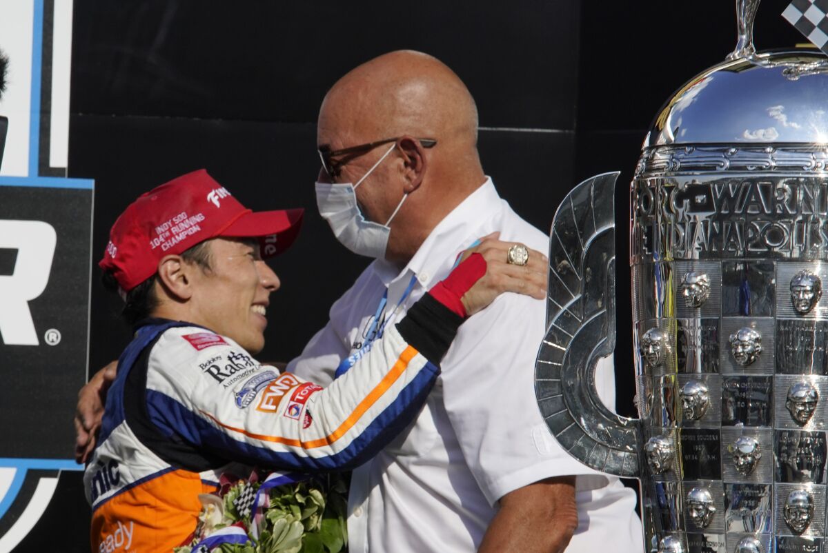 FILE - In this Sunday, Aug. 23, 2020 file photo, Takuma Sato, of Japan, celebrates with Bobby Rahal after Sato won the Indianapolis 500 auto race at Indianapolis Motor Speedway in Indianapolis. The future of two-time Indianapolis 500 winner Takuma Sato in the IndyCar Series was put in doubt Tuesday, Oct. 5, 2021 when Rahal Letterman Lanigan said the Japanese racer would not return to the team.(AP Photo/Michael Conroy, File)