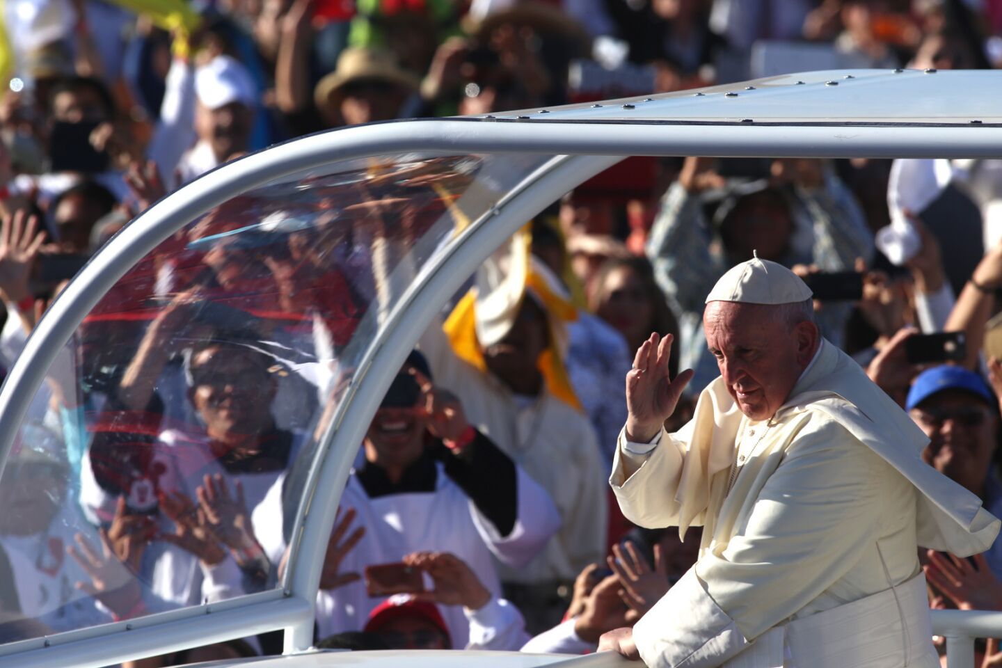 Pope Francis rides through the crowd at El Punto fairgrounds in Ciudad Juarez, Mexico.