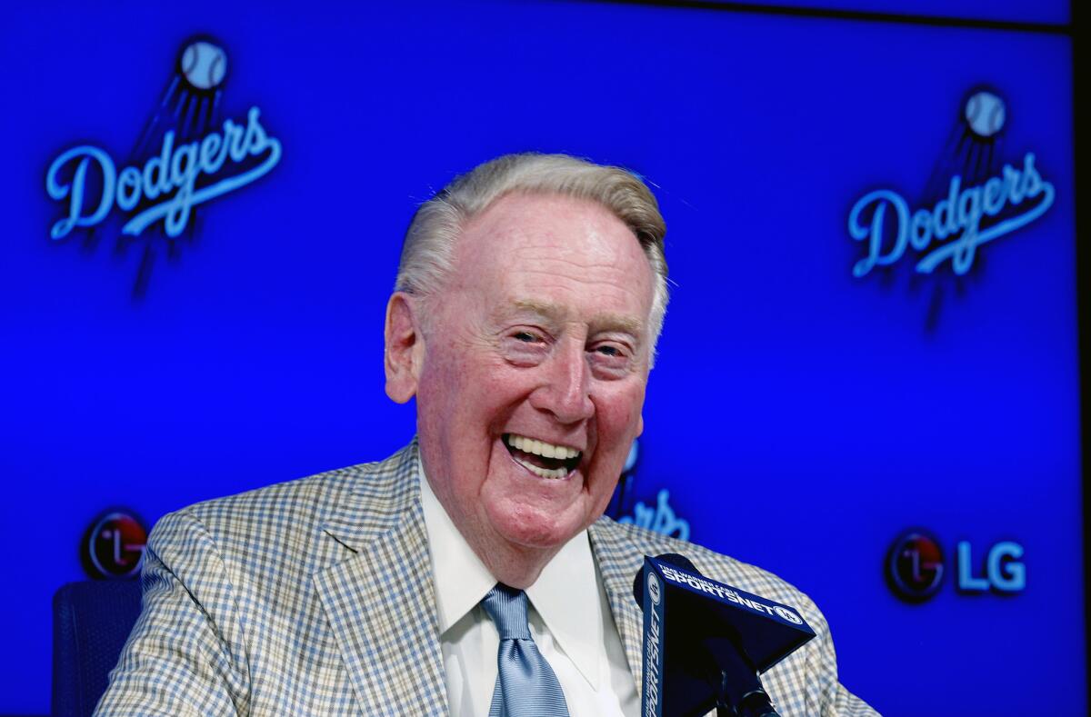 Vin Scully announces he will return to broadcast his 67th and final baseball season in 2016 at a news conference in Los Angeles on Aug. 29.