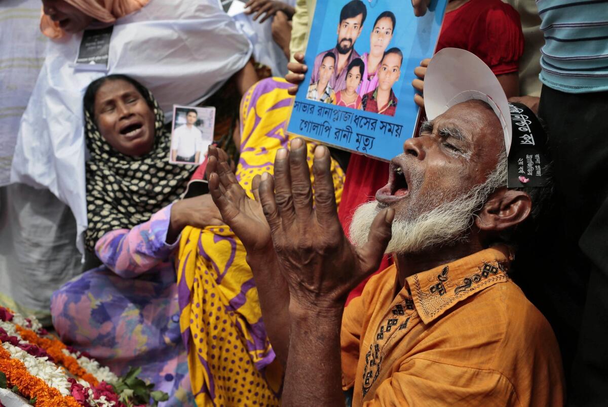 Bangladeshi relatives of victims of the Rana Plaza collapse gather at the spot on the second anniversary of the tragedy in Savar, near Dhaka, Bangladesh, on Friday.