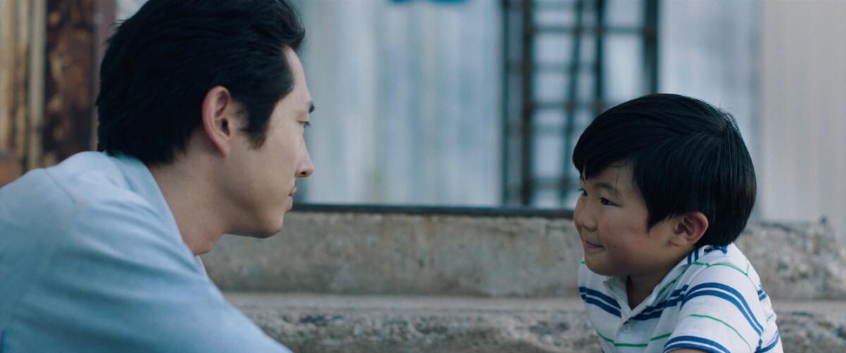 Steven Yeun and Alan S. Kim in the movie “Minari.”