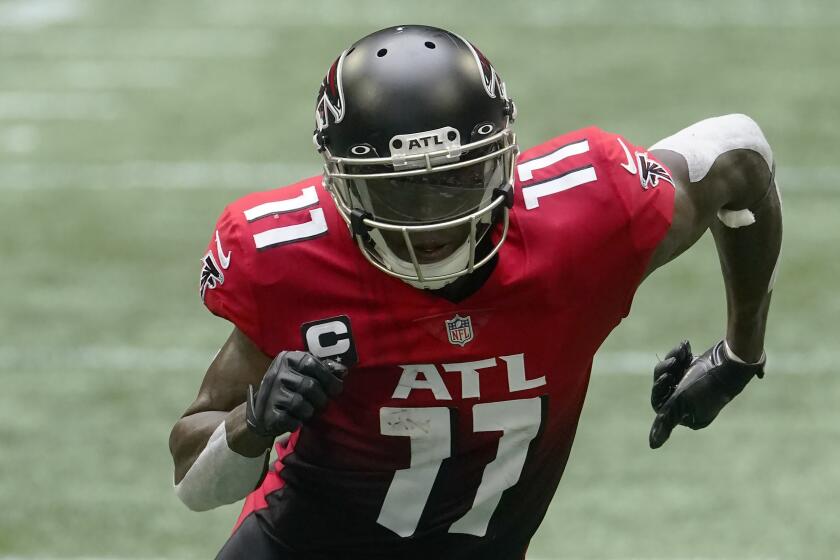 Atlanta Falcons wide receiver Julio Jones (11) works against the Detroit Lions during the second half of an NFL football game, Sunday, Oct. 25, 2020, in Atlanta. (AP Photo/John Bazemore)