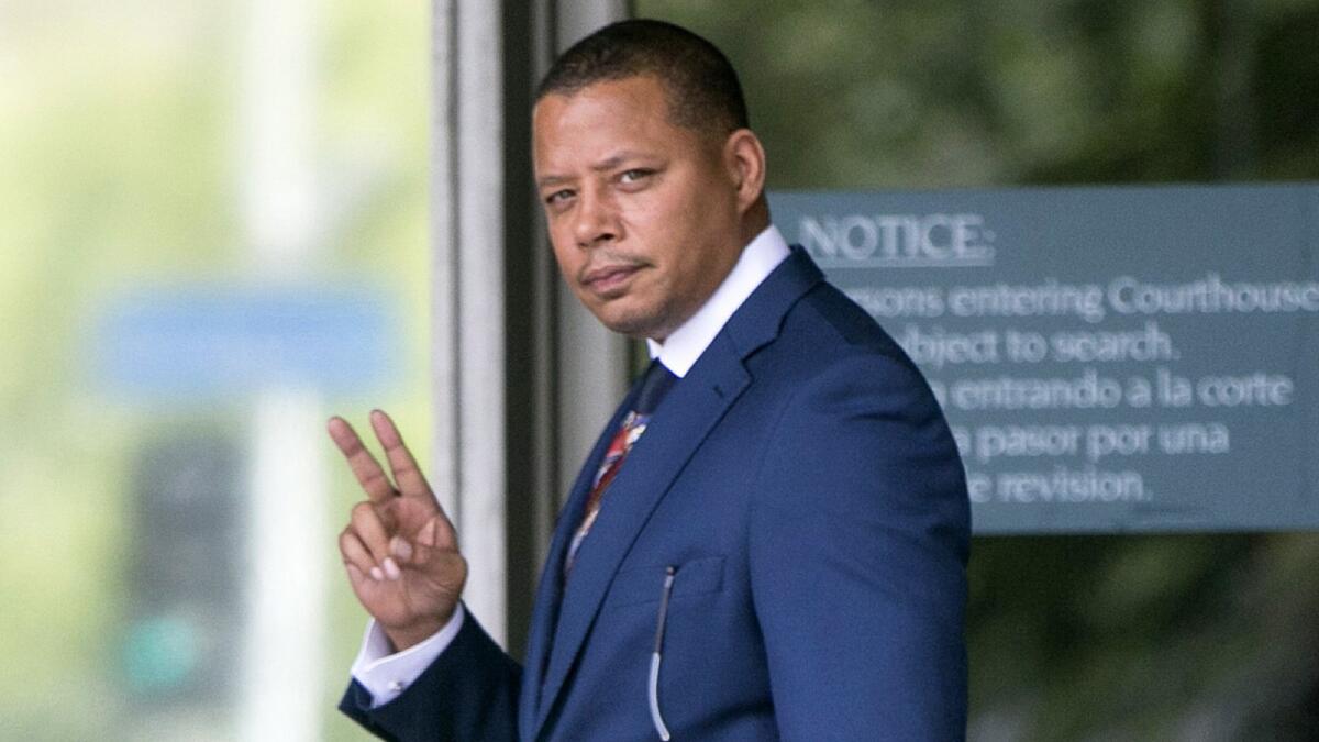 Terrence Howard walks into a Los Angeles courthouse on Aug. 13. A judge ruled in his favor on Monday, overturning his 2012 support agreement with ex-wife Michelle Ghent.