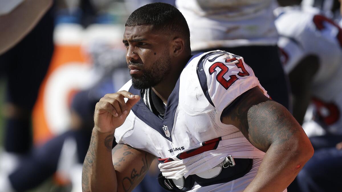 The Houston Texans' Arian Foster sits on the bench during a game against the Oakland Raiders on Sept. 14 in Oakland.