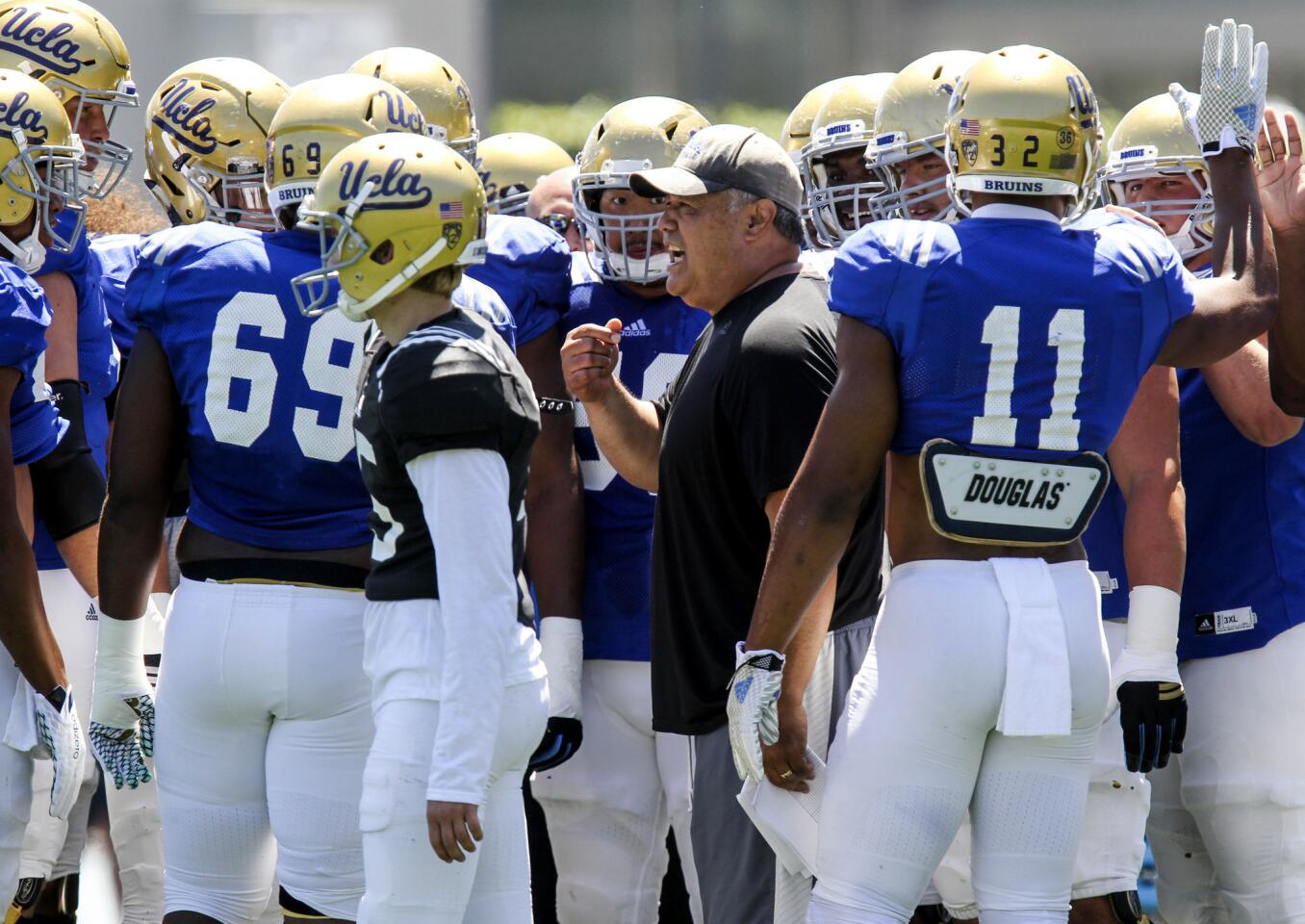 UCLA new offensive coordinator Kennedy Polamalu talks to his team during the UCLA Spring showcase on Apr. 23 at Drake Stadium, on the UCLA campus.